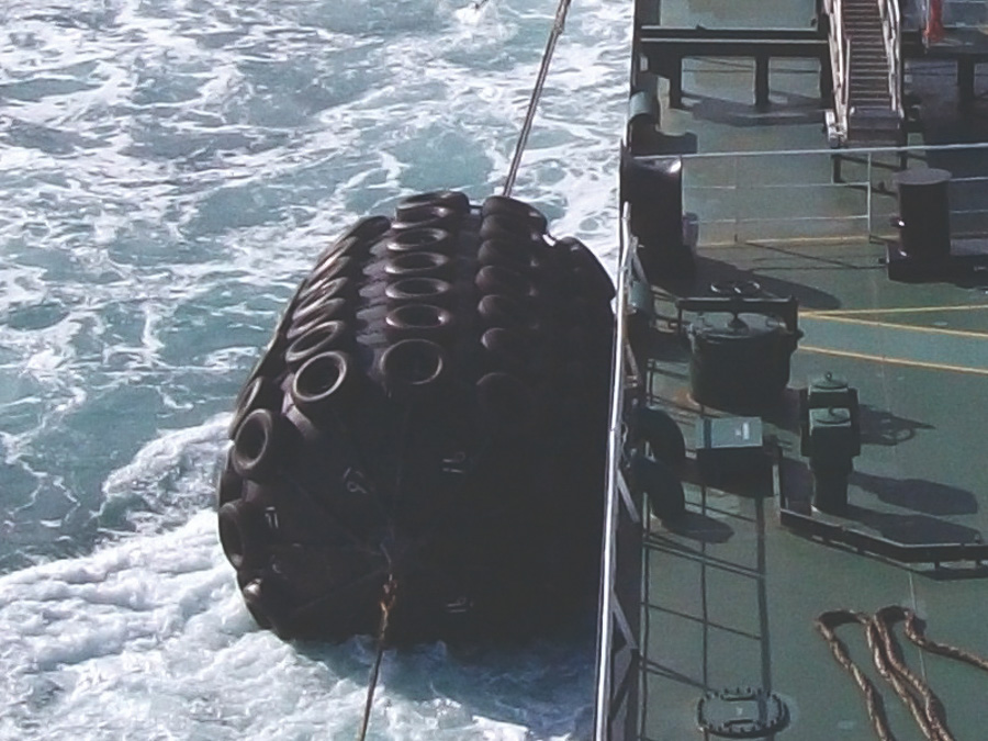 Pneumatic Yokohama fenders rigged to vessel