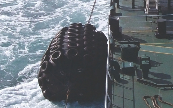 Pneumatic Yokohama fenders rigged to vessel